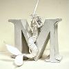 Image # 1: Letter Project,“M” Mermaid, Intro to 3D Design, 4” x 8” x 10” Paper and glue